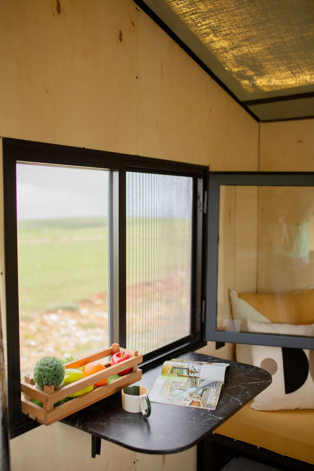 Folding table beneath a mobile-home window