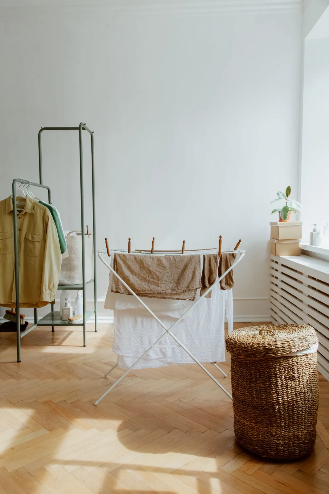 Indoor drying rack beside laundry baskets