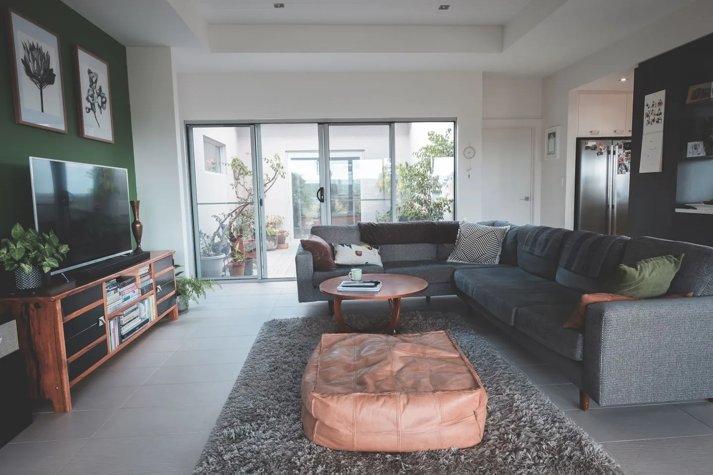 Large rug beneath living-room seating and a coffee table