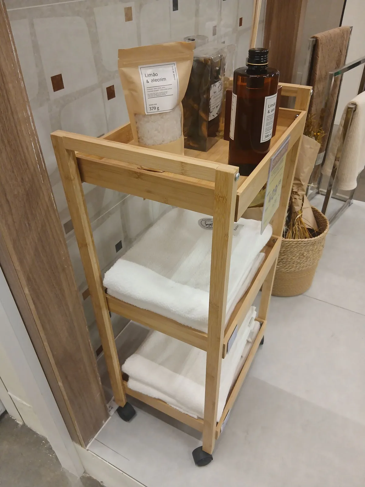 Freestanding wooden bathroom storage unit with towels