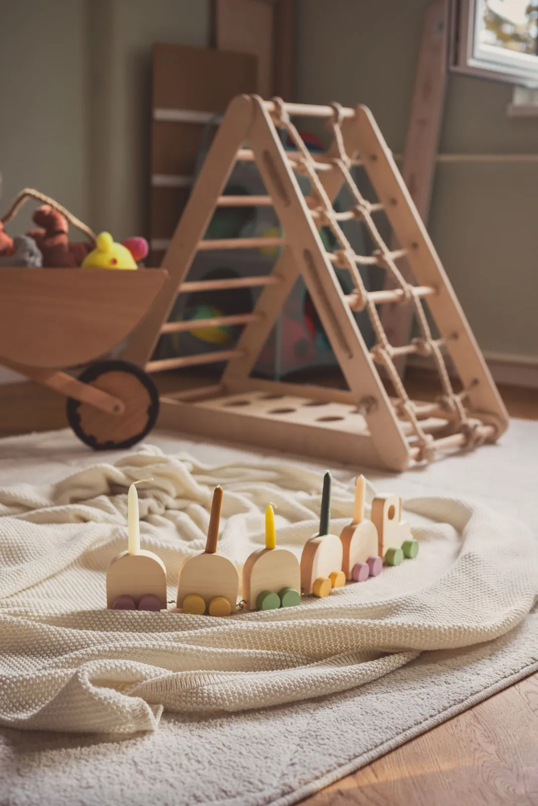 Wooden climbing frame and toys in a play corner