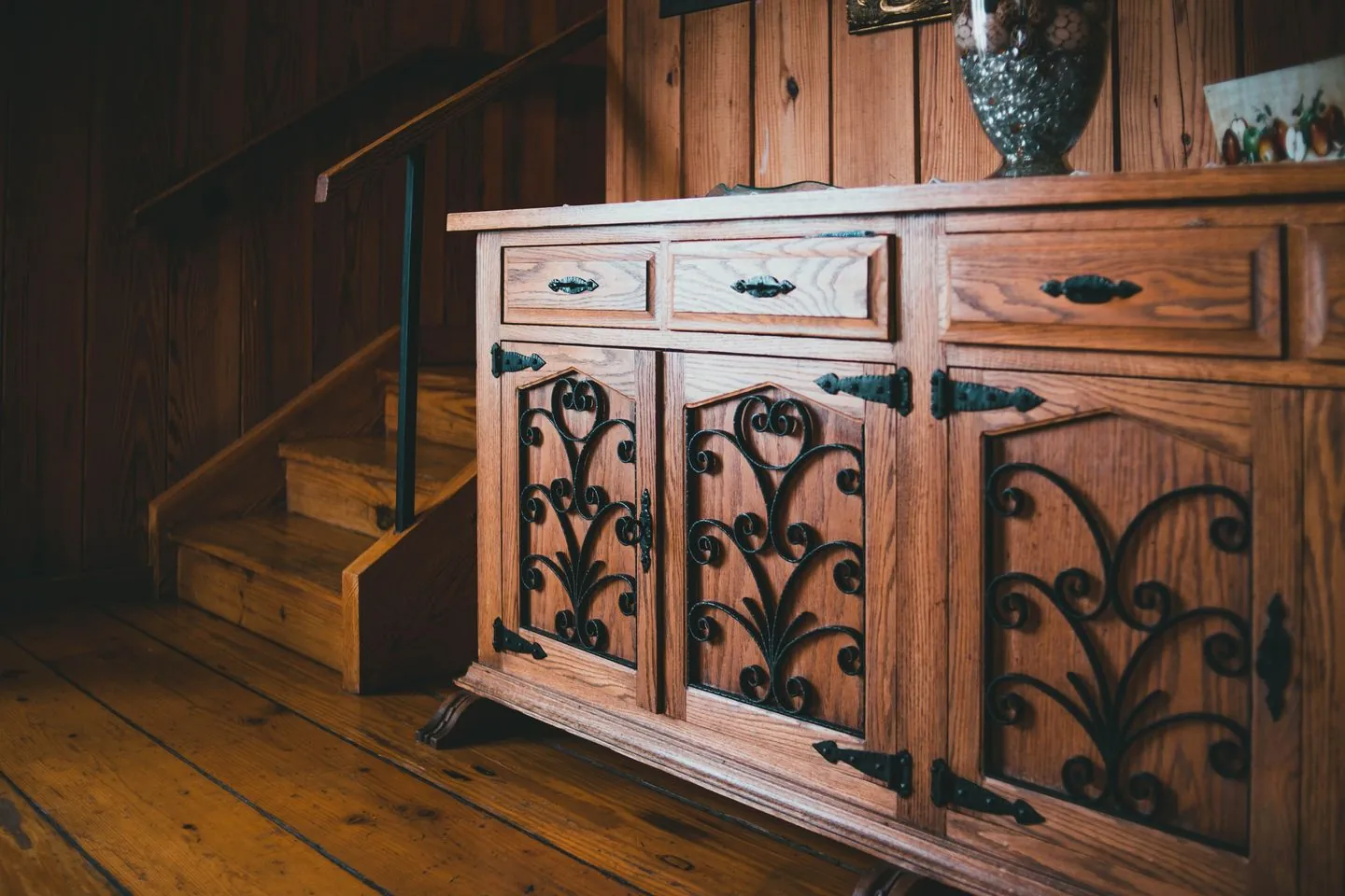 Storage cabinet positioned near a staircase
