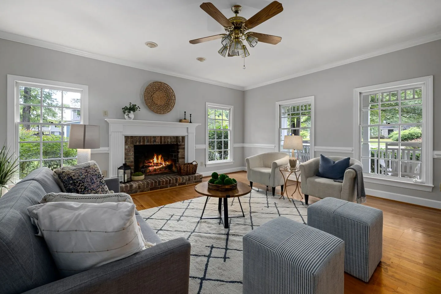 Living room with seating set back from the fireplace