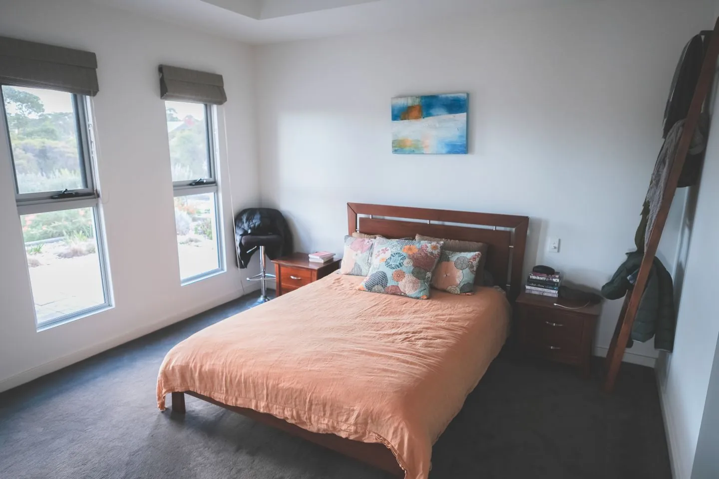 Compact bedroom with a wooden bed and bedside tables