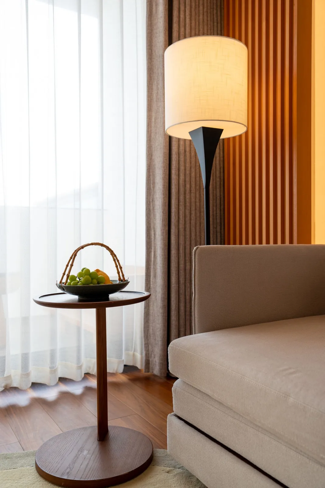 Small side table used beside a sofa and lamp