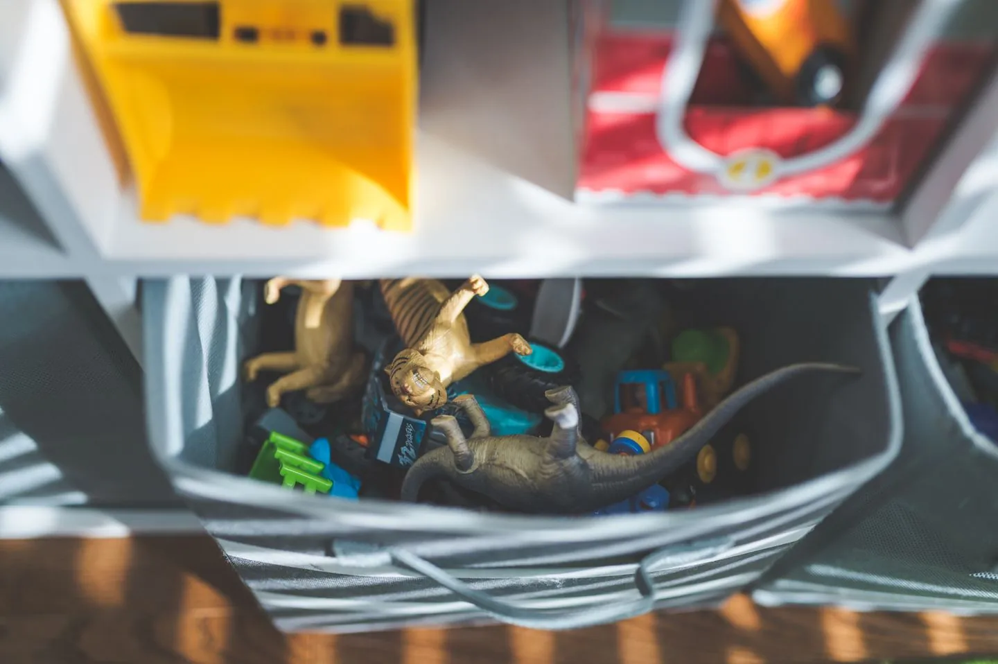 Toys sorted into separate storage containers
