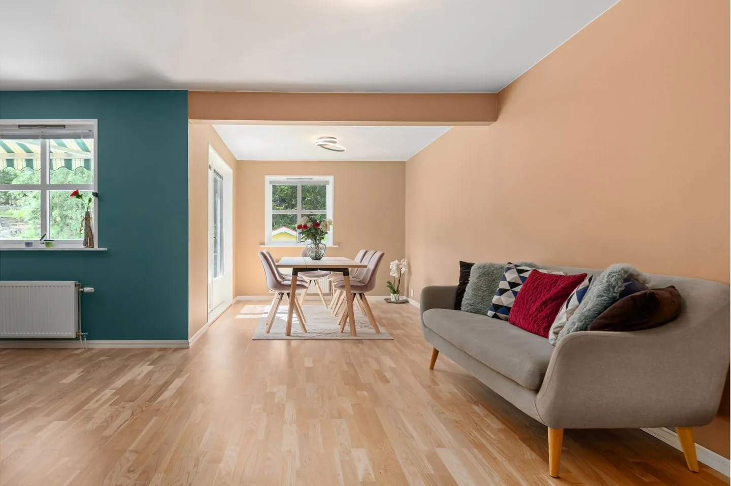 Sofa and dining table in a connected open-plan room