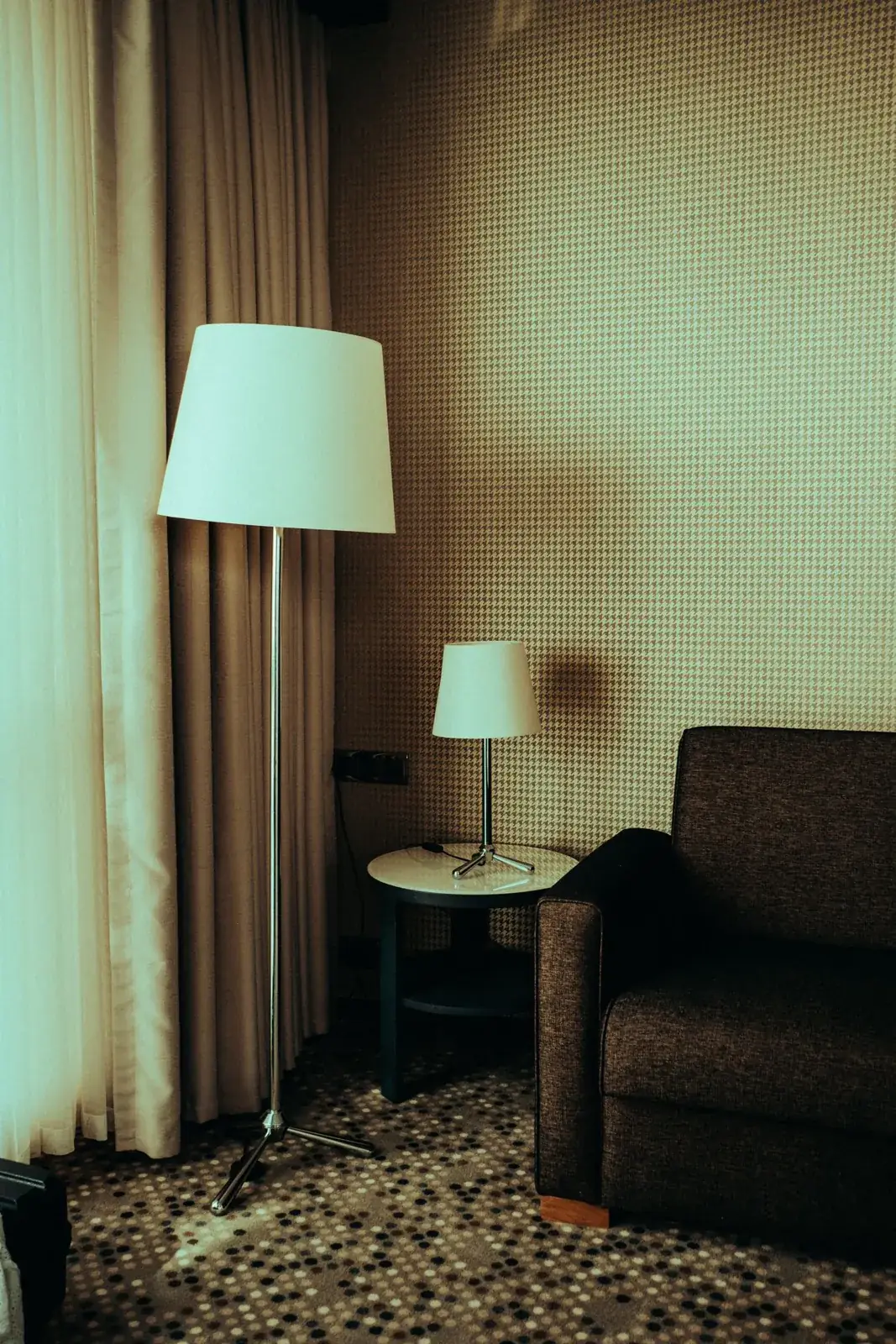 Floor lamp and table lamp beside a sofa