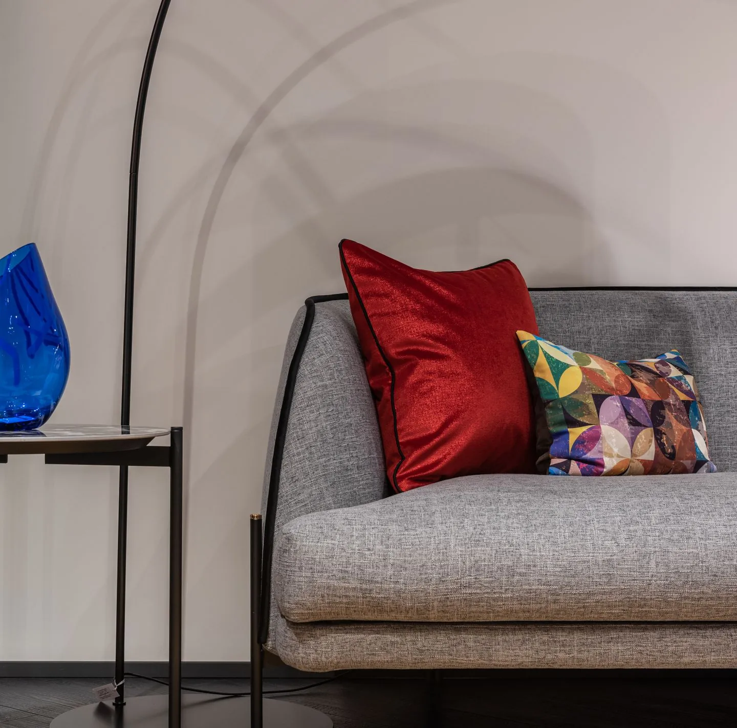 Grey sofa with contrasting patterned and plain cushions