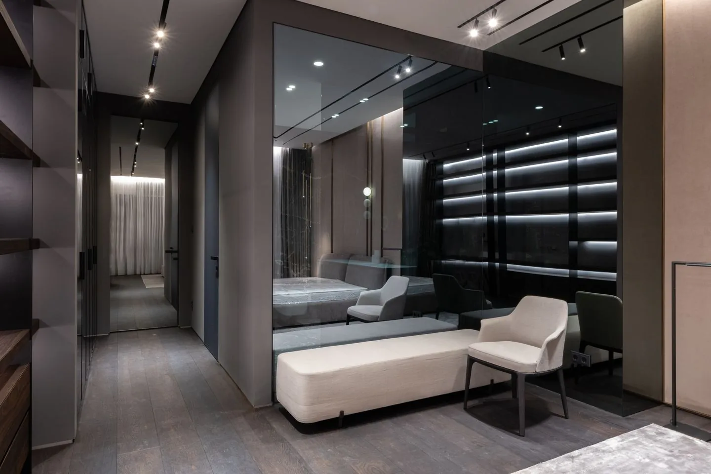 Large mirror reflecting a modern bedroom